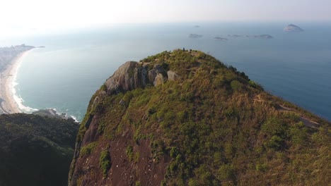 Aerial-Drone-Shot-of-Young-Adults-atop-a-Brazilian-Mountain-Taking-in-the-View