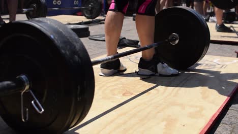 Tight-Shot-of-an-Olympic-Barbell-Bouncing-Off-the-Ground-After-a-Lift-at-a-Cross-Fit-Competition