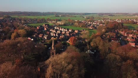Aerial-reveal-shot-of-British-Autumn-colours-countryside