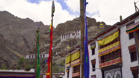 Beautiful-and-colorful-Hemis-Monastery-in-mountains-of-Himalaya-with-prayer-flags,-camera-dolly-parallax-movement