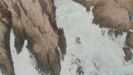 Aerial-view-of-a-small-inlet-being-hit-by-the-waves