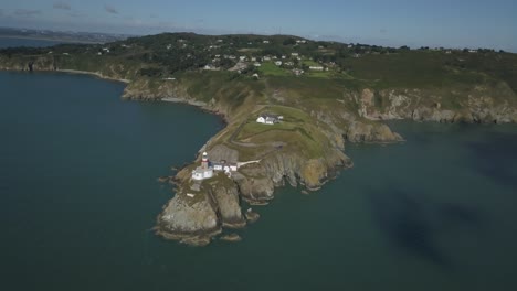 Aerial-view-of-beautiful-Bailey-Lighthouse-on-a-cliff-in-Howth,-Ireland