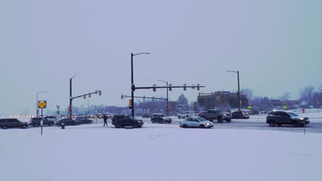 Cars-driving-on-snow-covered-highway