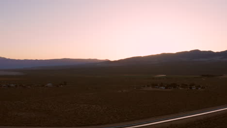 The-Sierra-Nevada-during-sunrise-with-in-the-background-a-hotel-and-RV-campsite