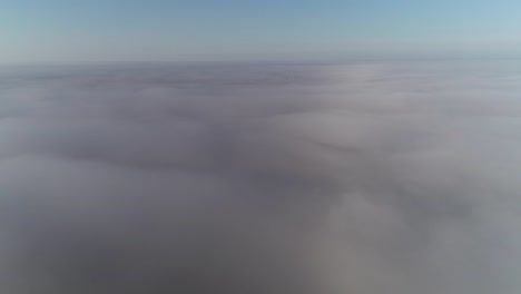 Flight-above-clouds-in-morning-golden-hour