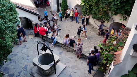 Locked-shot-of-People-dancing-bebop-inside-the-Bran-castle-courtyard