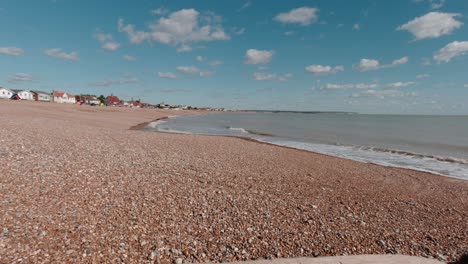 Waves-gently-breaking-at-empty-shingle-beach-in-Pevensey-in-south-England