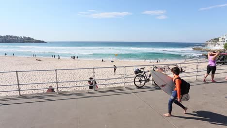 People-of-all-ages-enjoying-a-walk-on-the-Promenade-at-Bondi-Beach,-Sydney-Australia-in-Springtime