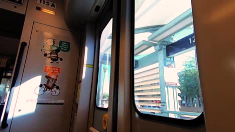 Time-lapse-with-speed-ramp-of-the-Phoenix-Metro-Light-Rail-traveling-through-the-city-slowing-as-it-arrives-at-the-station,-Phoneix,-Arizona