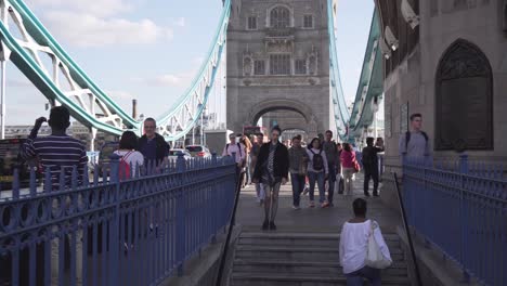 People-going-down-stairs-from-Tower-Bridge-in-London,-static-view