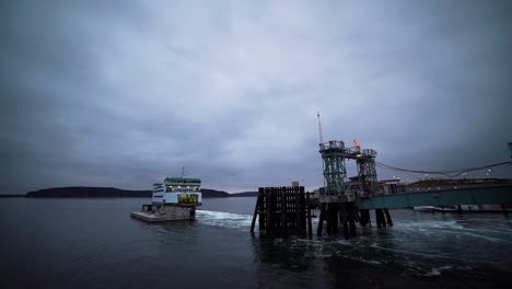 Early-morning-launch-of-the-Point-Defiance-to-Vashon-Island-Ferry,-mostly-cloudy,-gloomy,-calm-salt-water,-hyperlapse,-moving-time-lapse