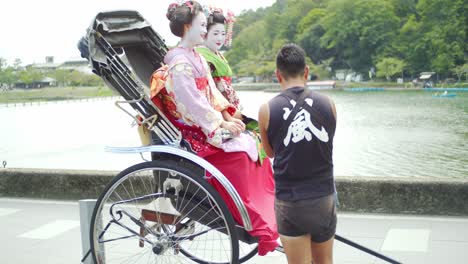 Beautiful-Maiko-sitting-in-a-rickshaw-in-Kyoto,-Japan-soft-lighting-slow-motion-4K