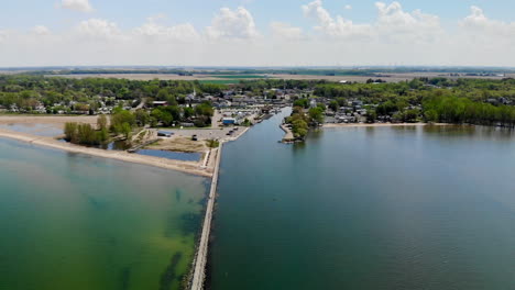 Aerial-footage-over-Lake-Huron-approaching-small-rural-town-of-Caseville,-Michigan