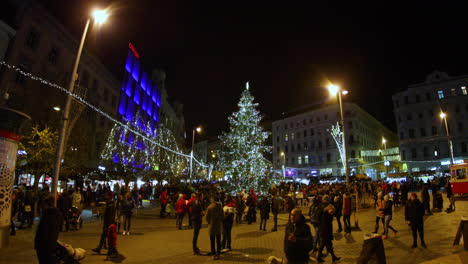 View-of-the-whole-square-in-the-city-center-of-Brno-and-its-landmark-high-Christmas-spruce-during-a-night-event-full-of-people-captured-at-4k-60fps-slow-motion