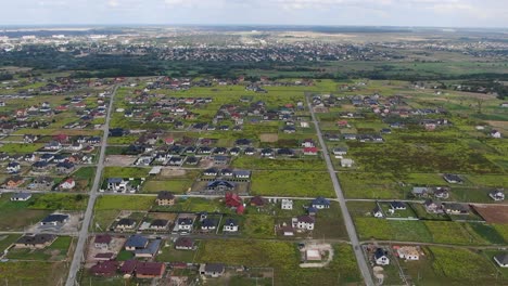 Aerial-View-of-Eastern-European-Neighborhood-With-Scattered-Houses-and-Fields