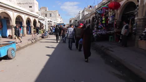 Steadicam-motion-moving-through-shopping-areas-of-Essaouira,-Morocco