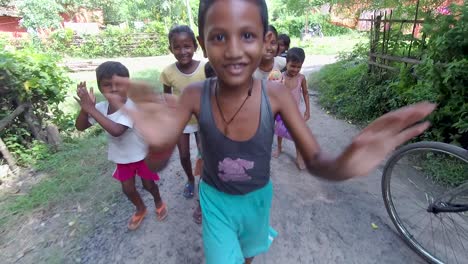 Homeless-street-children-laughing-at-camera-and-running-towards-it,-poverty-and-hunger,-slow-motion