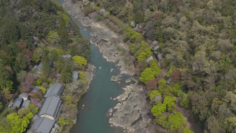 Katsura-river-in-Spring,-Aerial-shot-over-valley-in-Arashiyama