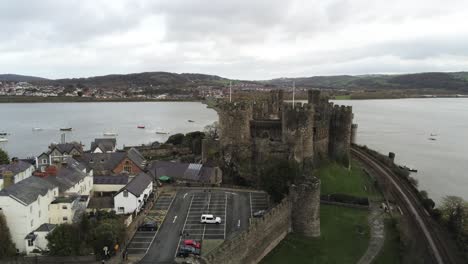 Historical-medieval-Conwy-castle-landmark-aerial-view-approach-forwards