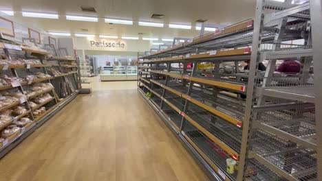 Empty-shelves-with-no-customers-around-in-the-bread-section-of-the-supermarket-Sainsbury's-in-London-during-the-Coronavirus-pandemic
