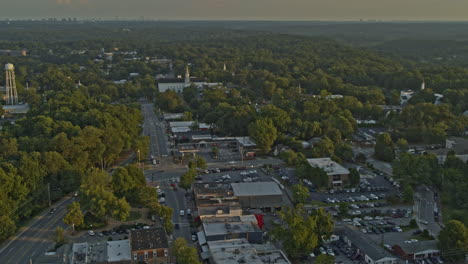 Roswell-Georgia-Aerial-v3-birdseye-shot-of-calm-neighborhood,-traffic-and-forest-during-sunset---DJI-Inspire-2,-X7,-6k---August-2020