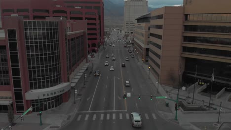 Tilt-up-aerial-flight-down-Colorado-Avenue,-urban-Colorado-Springs