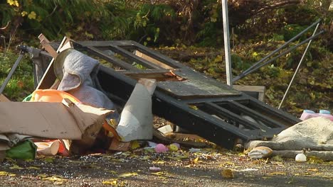 Fly-tipping-of-domestic-rubbish-onto-a-lay-by-on-an-English-country-road