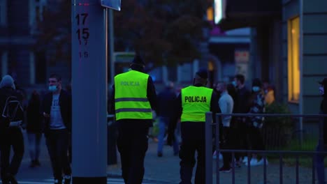 Polish-Police-Officers-At-The-Demonstration-Site-In-Szczecin,-Poland---Young-People-Protesting-Against-Total-Ban-On-Abortion---wide-shot,-slow-motion