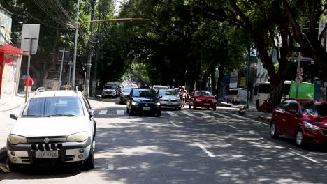 Vehicular-traffic-on-a-Manaus,-Brazil-city-street---establishing-shot