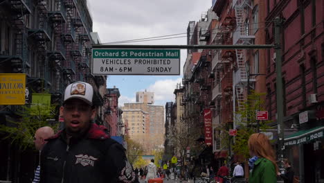 Orchard-Street-Pedestrian-Mall,-Street-Scene-as-Locals-and-Tourists-Walk-in-Lower-East-Side