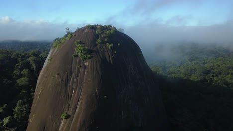 Amazing-Voltzberg-granite-dome,-Suriname-mountain-in-rainforest-jungle,-aerial