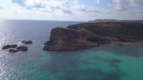 Wide-aerial-view-of-one-of-many-small-islands-just-off-the-coast-of-Comino,-Malta