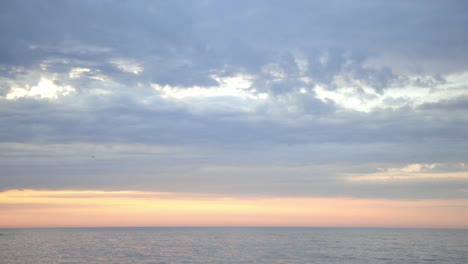 Stunning-Landscape-Of-Sunrise-Over-The-Calm-Ocean