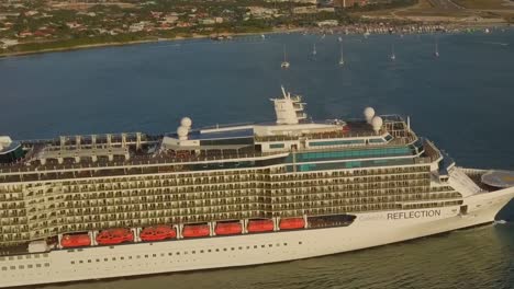 Aerial-close-up-view-of-the-side-on-the-cruise-ship-sailing-in-the-water
