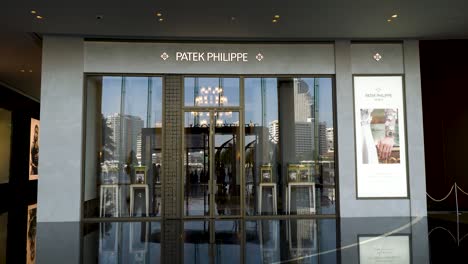 Front-entrance-to-Patek-Phillipe-wristwatch-store-in-luxury-Icon-Siam-interior-shopping-mall,-Bangkok