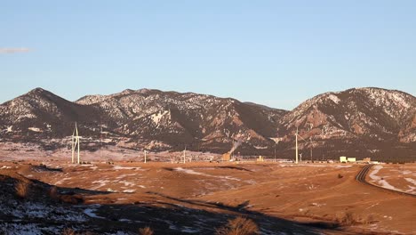 Peaceful-sunrise-along-Colorado's-front-range-with-the-Flatirons-and-windmills,-near-Boulder-Colorado
