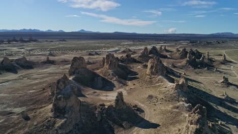 High-aerial-view-pulling-away-slowly-from-the-Trona-Pinnacles-rock-formations-on-a-sunny-morning