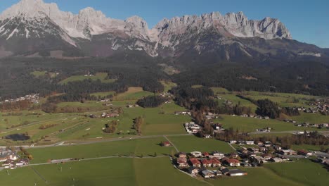 AERIAL:-Tilt-up-drone-shot-of-famous-mountain-panorama-in-austrian-alps