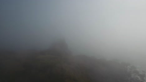 AERIAL:-Cutting-through-the-Oregon-fog-our-drone-begins-to-reveal-a-rock-formation