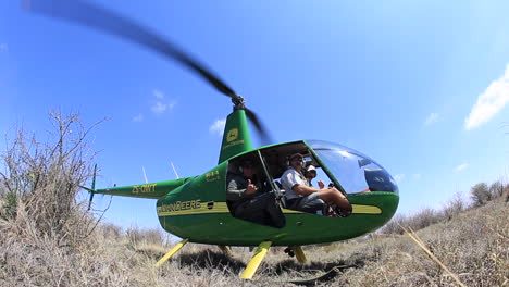 A-group-of-conservationists-fly-in-a-Robinson-44-over-the-MAdikwe-Private-game-reserve-in-search-of-White-and-Black-rhino-to-dart-in-a-conservation-effort
