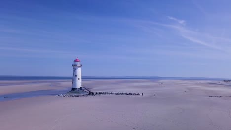 Drone-footage-showing-Point-of-Ayr-Lighthouse,-Talacre-Beach,-North-Wales,-UK