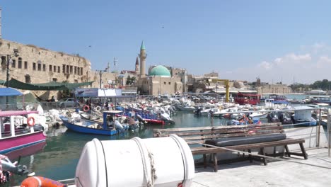 Panorama-of-marine-in-Acre,-Israel-with-tourist-boats-and-sailing-yachts