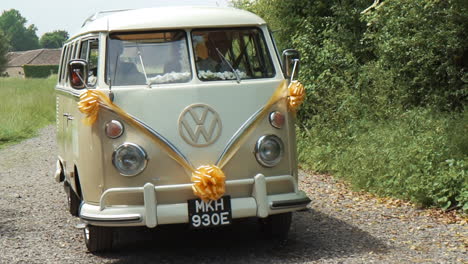Slow-motion-shot-of-a-VW-Camper-being-used-as-a-wedding-car