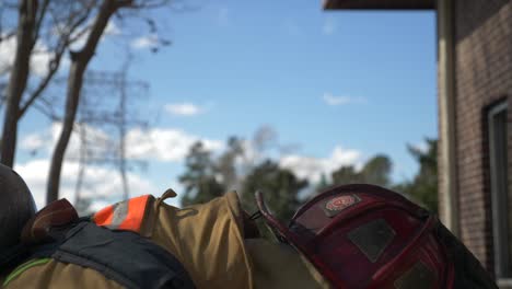 Firefighter-puts-on-firefighting-helmet-to-be-ready-to-fight-a-fire