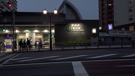 TOKYO,-JAPAN---:-JR-KOMAGOME-station,-North-exit,-4K,-people-in-the-twilight,-hurrying-crowd,-zoom-out,-Camera-fixed,-Angle-neutral-view