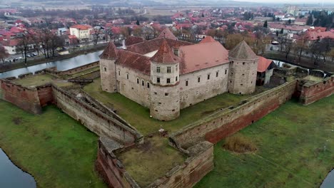Aerial-orbit-around-the-Fagaras-fortress-in-Brasov's-county,-Romania