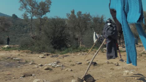 Man-horse-riding-in-Greek-mountains-with-thousands-of-olive-trees-in-backgorund