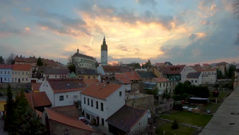 handheld-wide-angle-pan-over-downtown-Litomerice-in-sunset-with-beautifully-lit-clouds