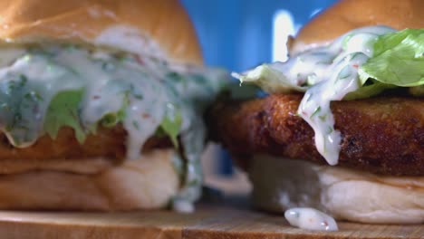Close-Shot-of-Two-Homemade-Fishcake-Sliders-with-Dripping-Sauce