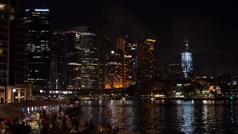 Sydney,-Australia---High--Rise-Buildings,-Bright,-Lights,-Big-City-With-Tourists-At-The-Bay---Your-Dream-Vacation-Destination-For-The-Holidays---Wide-Shot